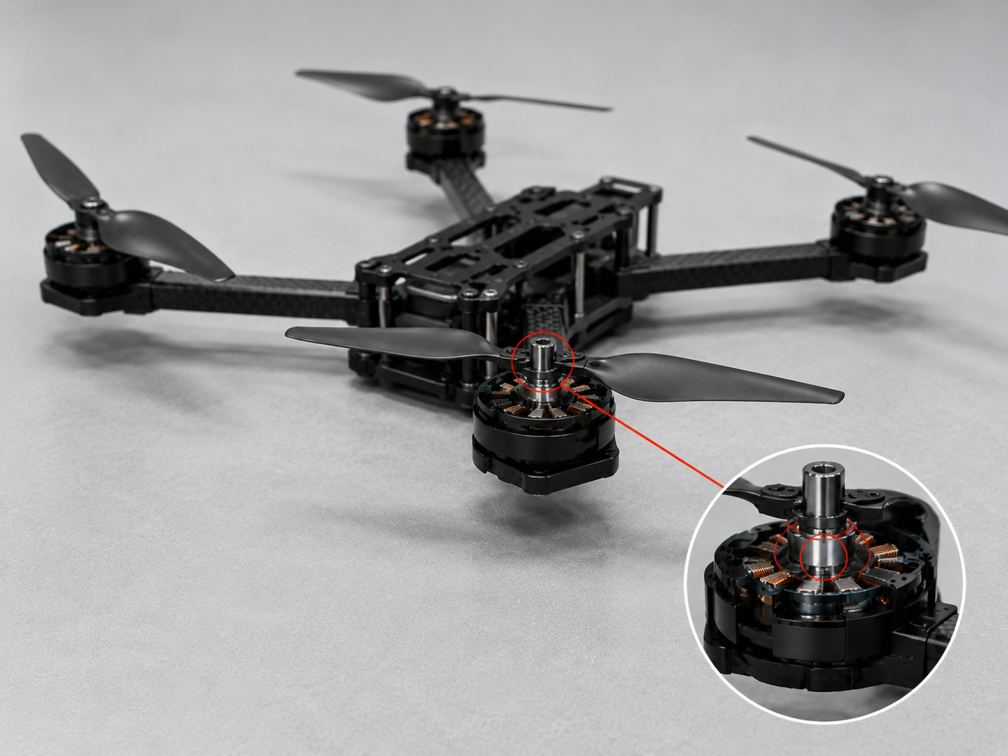 Quadcopter drone with a highlighted motor shaft bearing and internal close-up